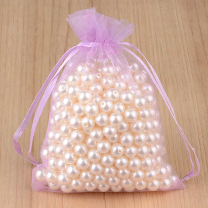 100 peças 24 cores bolsa de embalagem de joias 5*7 7*9 9*12 10*15cm sacos de organza armazenamento de presentes bolsas de cordão de casamento atacado 