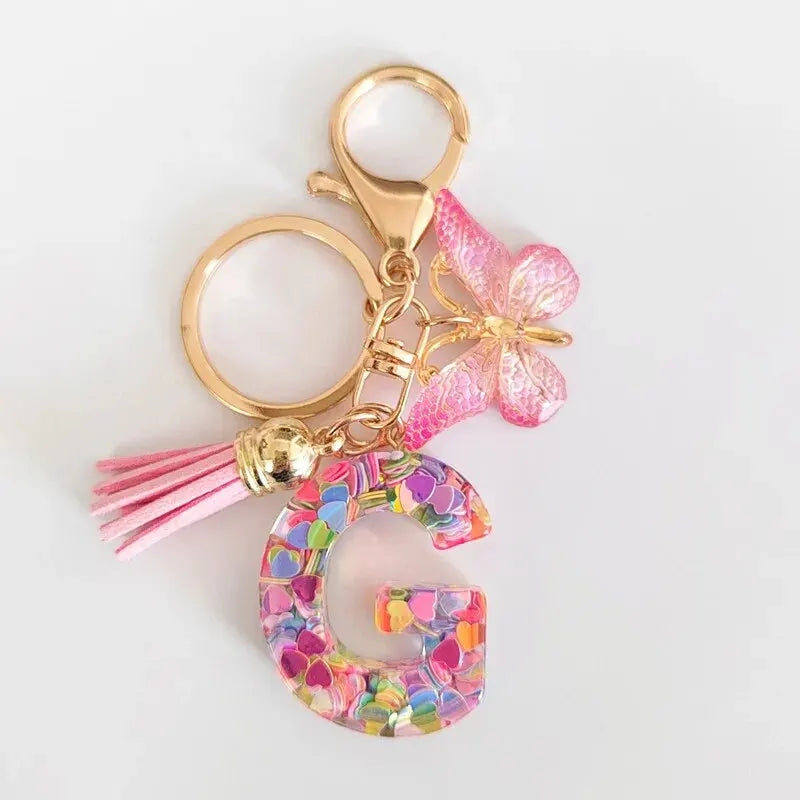 Nuevo llavero de resina de moda con cuentagotas con purpurina rosa y letras en inglés, colgante con borla de mariposa, accesorio para vacaciones 