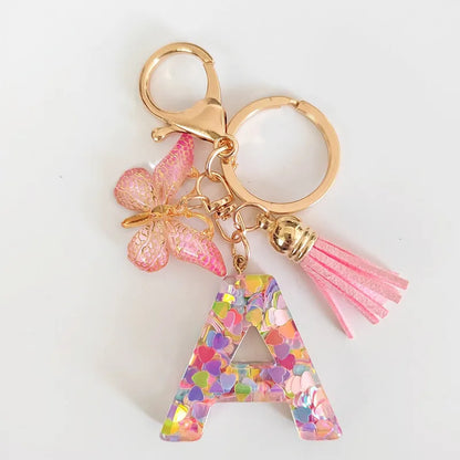 Chaveiro de resina novo e moderno, conta-gotas com glitter rosa, pingente de letra em inglês, acessório de borla de borboleta, chaveiro de férias 