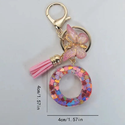 Nuevo llavero de resina de moda con cuentagotas con purpurina rosa y letras en inglés, colgante con borla de mariposa, accesorio para vacaciones 