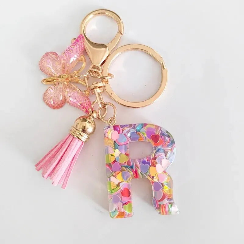 Nuevo llavero de resina de moda con cuentagotas con purpurina rosa y letras en inglés, colgante con borla de mariposa, accesorio para vacaciones 