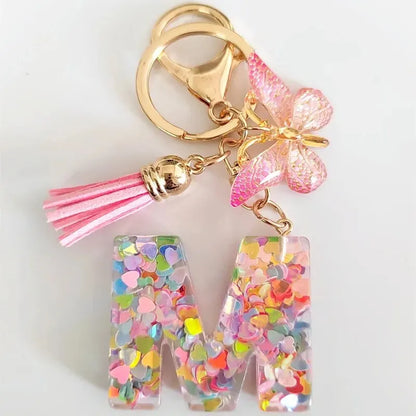 Nuevo llavero de resina de moda con cuentagotas con purpurina rosa y letras en inglés, colgante con borla de mariposa, accesorio para vacaciones 