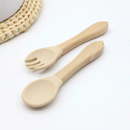 Hot selling food grade silicone wooden handle spoon and fork set for complementary food feeding training spoon and fork Leedoar