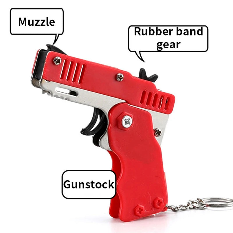 Wholesale Mini Rubber Bands Shoot Gun Alloy Material Multi Function 6 Colors Key Chain Collapsible Funny Mini Gun Toys For Kids Leedoar